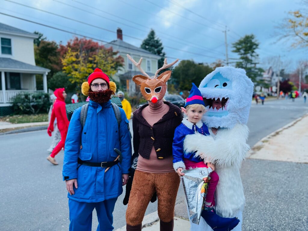 Family in costumes goes trick or treating